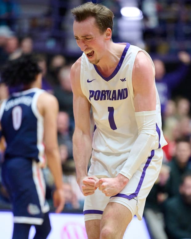 Portland Pilots forward Moses Wood (1) reacts during the first half after scoring a three point basket